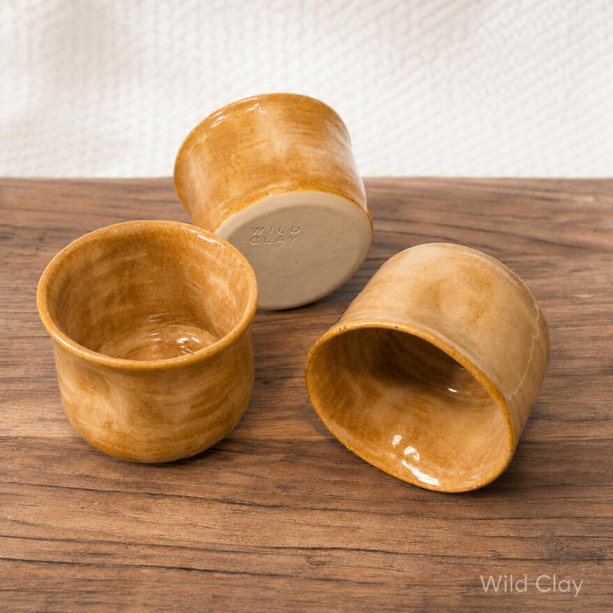 Squeeze Tumbler - Butterscotch $22.50 (175 ml) 3 in stock Hand-thrown with gentle curves and a butterscotch glaze, unique every time.