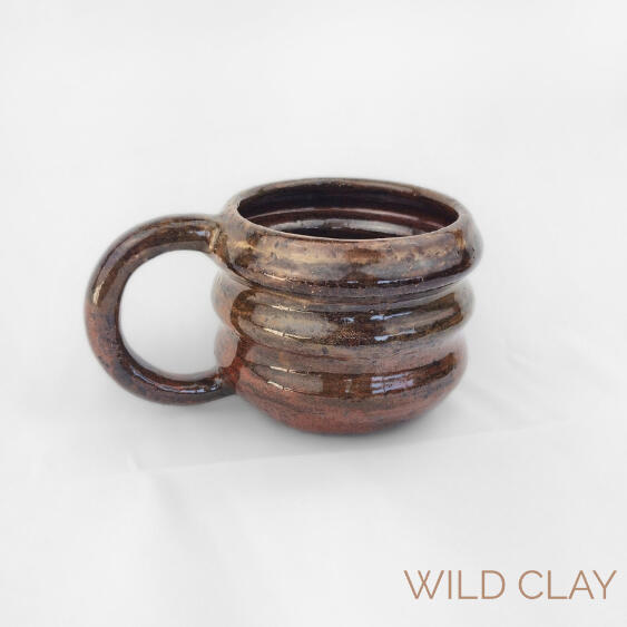 Campfire Mug $45.00 | 275ml | 1 Available Wheel thrown stoneware mug with layered curves and deep earthy hues.