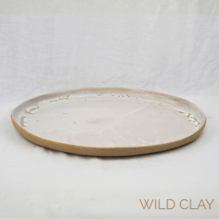 Little Miss Muffet Platter $158.50 | 30cm W x 42cm L | 1 available White Curds and Whey glaze that breaks into the speckled clay around the rim. In use image in gallery