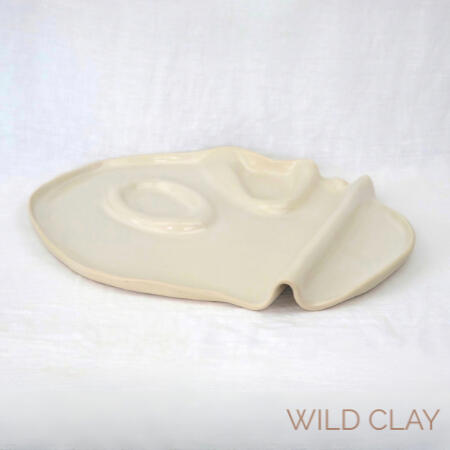 White Charcuterie from $160.00 | 39 by 40cm | Preorder A wave platter in a clean white glaze, with a modern abstract look. In use image in gallery