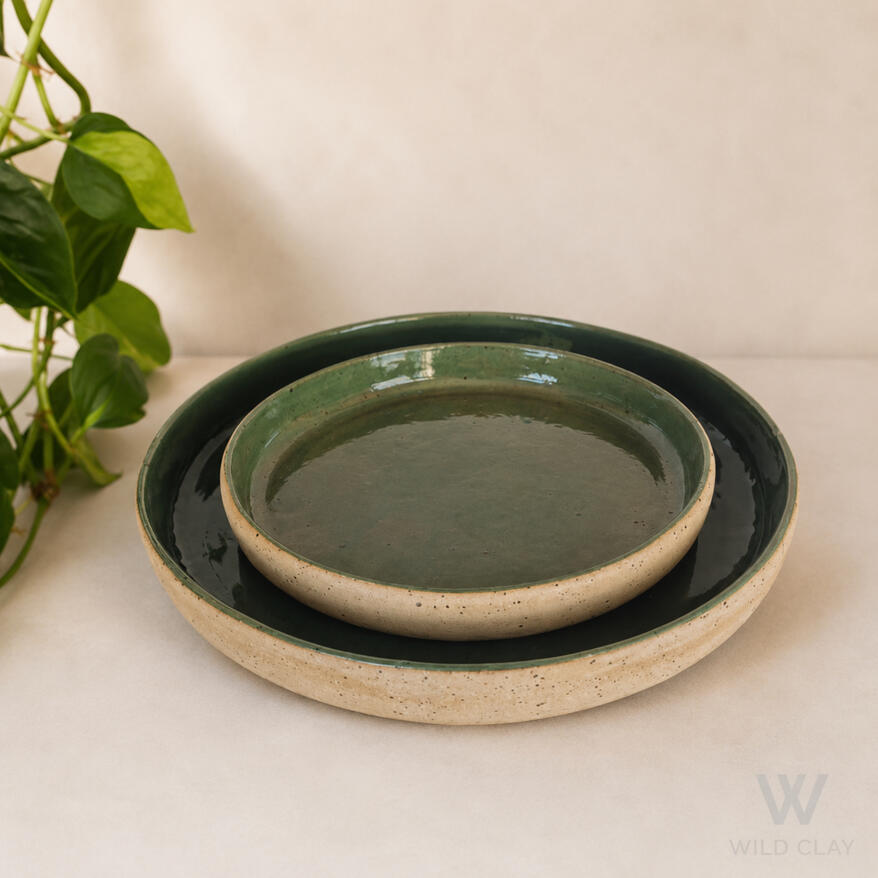 Serving Platter - Green Speckle Large $127.67 | 34 cm | Preorder Small $65.99 | 26 cm | 1 in stock A stoneware platter in a deep green speckle, a rich centrepiece for the table.